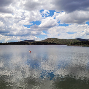 Single Paddler On Calm Parker Canyon Lake Waters